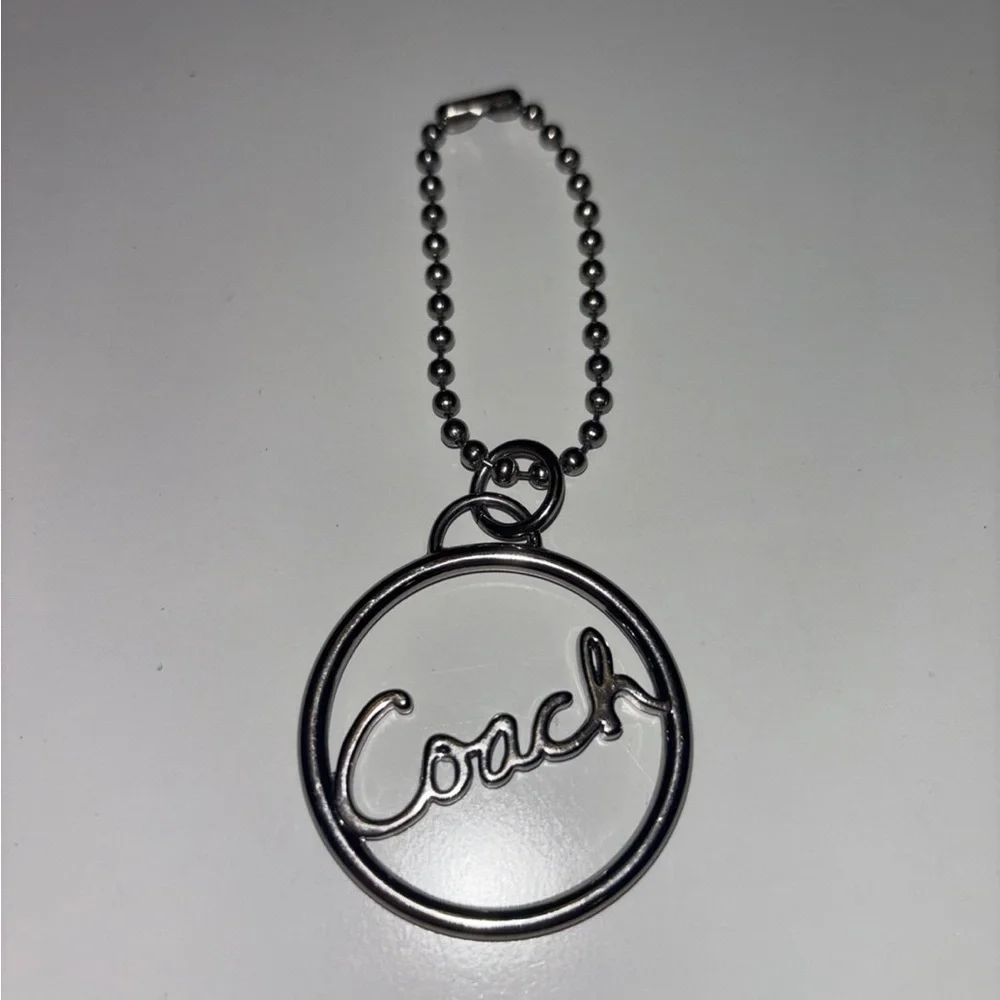 Coach round silver script spellout metal hang tag purse charm chain
